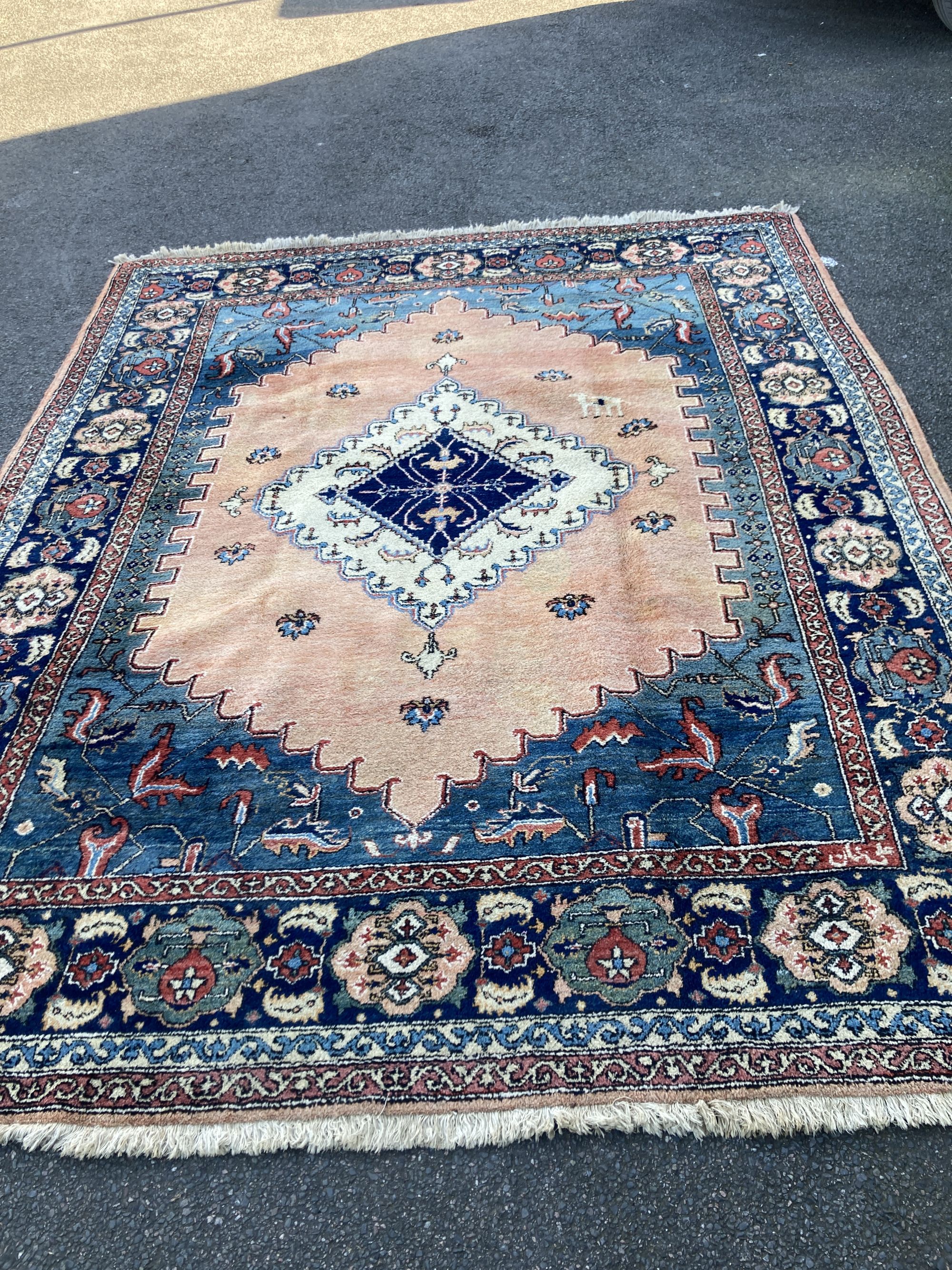 A Persian Shah-Savan carpet, 331 x 268cm